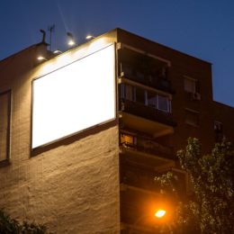 Billboard lit up on side of building