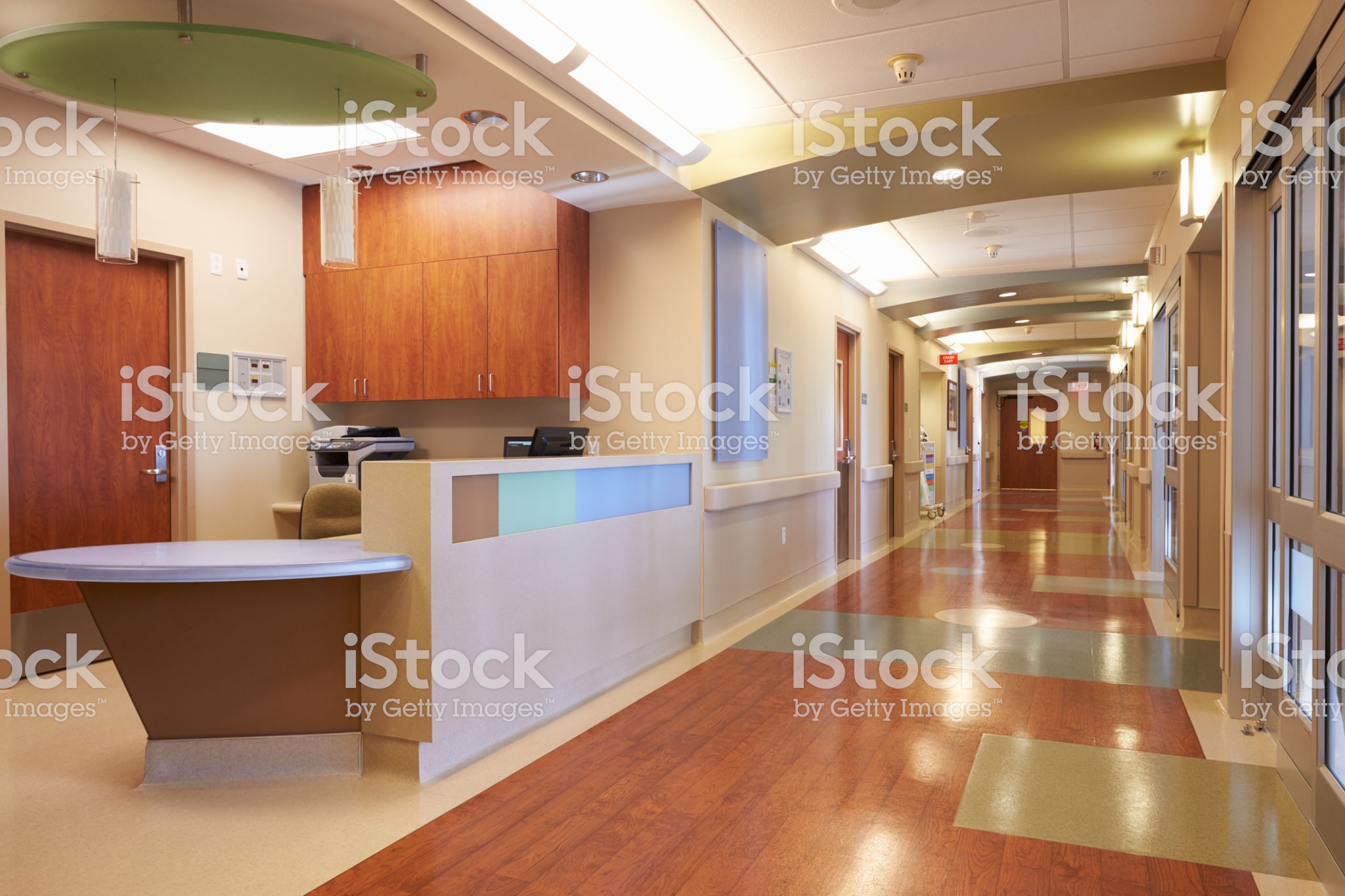 Empty Nurses Station And Corridor In Modern Hospital